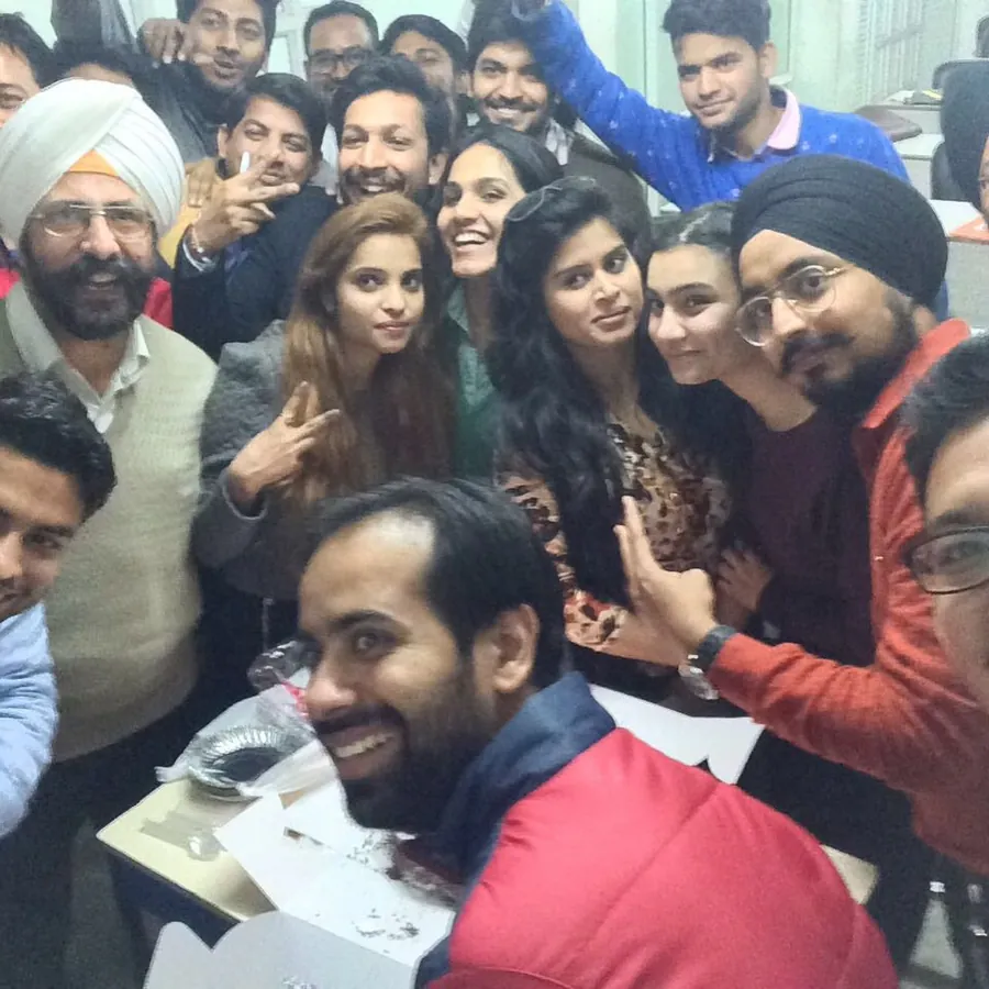 A crowded group selfie of Gaurav with a batch of students
