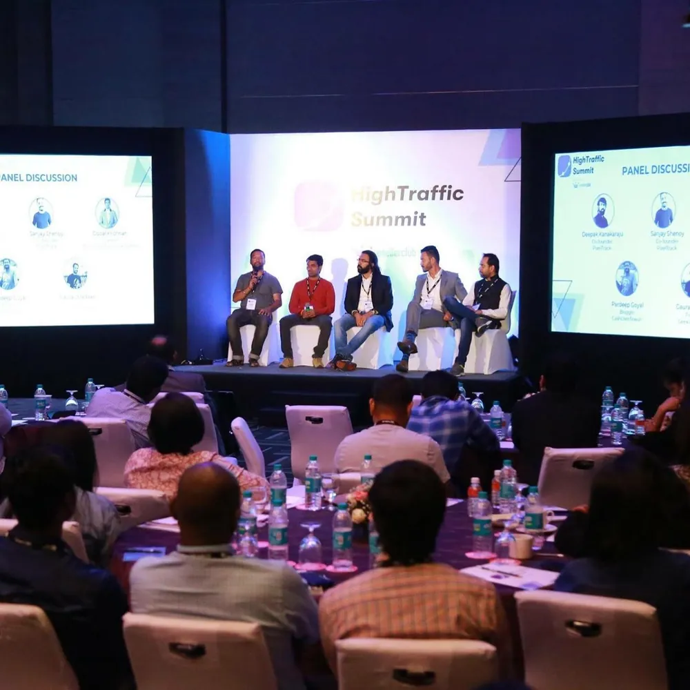 A panel on stage at HighTraffic Summit seen from the audience